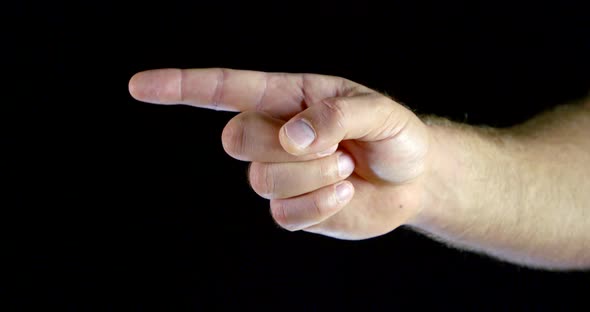 Close - Up Male Hand Gesture with Index Finger Towards Black Isolated Background