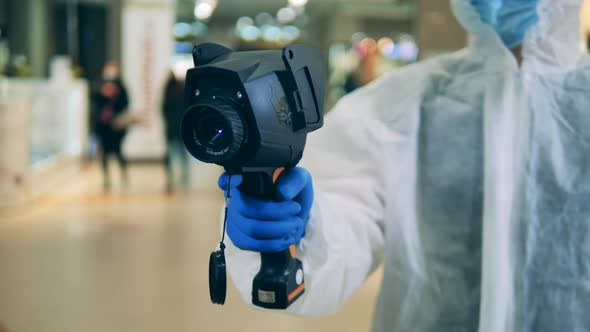 Thermographic Camera in the Hands of a Medical Worker