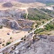 Aerial drone view of burned forest next to the road. Forest fire. Climate change, ecology and land. - VideoHive Item for Sale