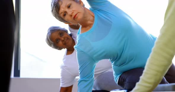 Senior women performing yoga 4k