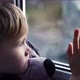 A Beautiful Little Blonde Boy Looking Out a Sunny Window Waiting on Her Daddy to Come Home from Work - VideoHive Item for Sale