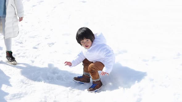 Cute Asian Child Playing Snow Outdoors Slow Motion