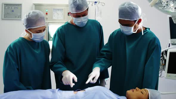 Surgeons interacting with each other in operation room