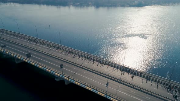 Marathon Running on the Bridge. Dolly Shot