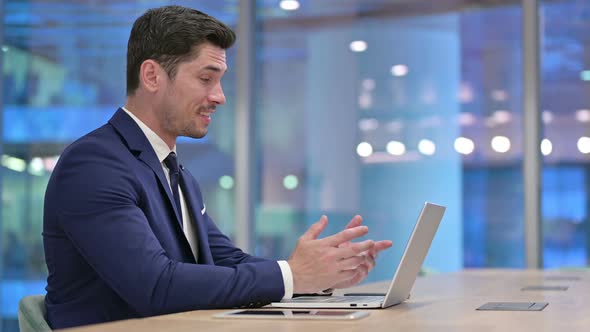 Businessman Talking on Video Call at Work