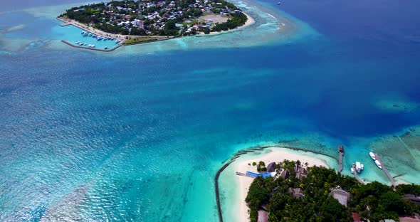 Beautiful above tourism shot of a sunshine white sandy paradise beach and aqua turquoise water backg