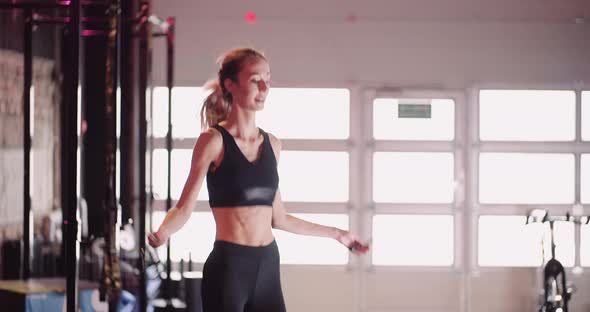 Slim Female Athlete Training At Fitness Club