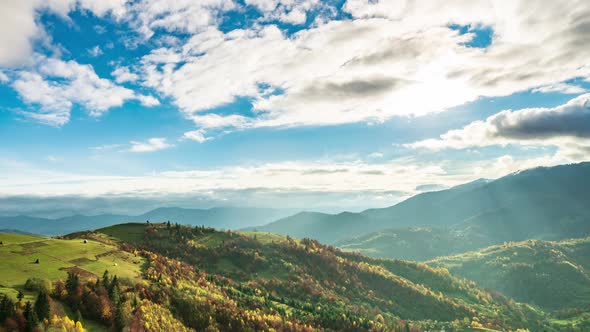 Time Lapse of Blue Sky with Clouds Over Mountain