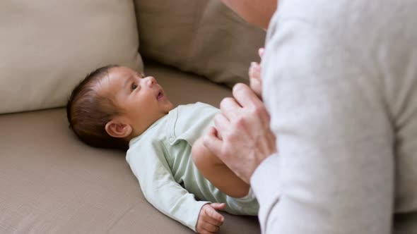 Happy Father Playing with Little Baby Boy at Home 18