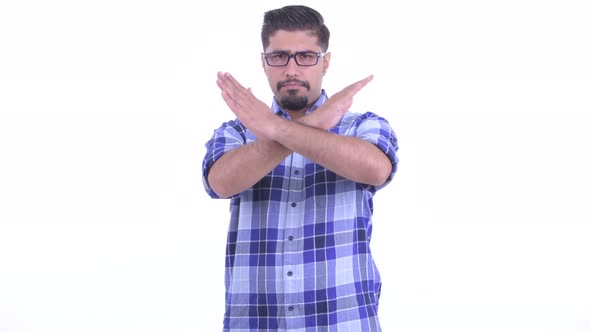 Serious Bearded Persian Hipster Man with Stop Gesture