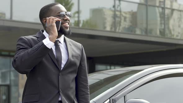 Business Lawyer Talking Over Phone and Smiling, Celebrating Successful Case
