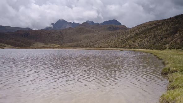 Landscape view of Ruminawi Volcano and Lake Limpiopungo, Ecuador, on a cloudy day