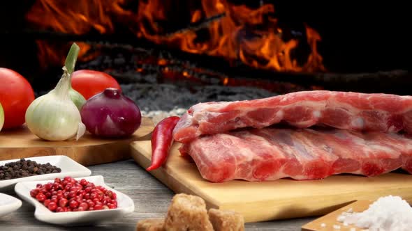 Closeup of the Ribs Next to Ingredients for the Preparation of the Grilled Ribs