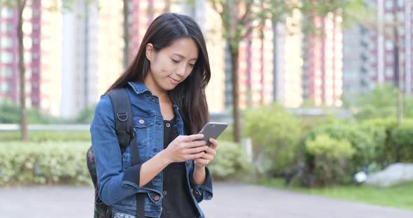 Woman Use of Smart Phone in The Park