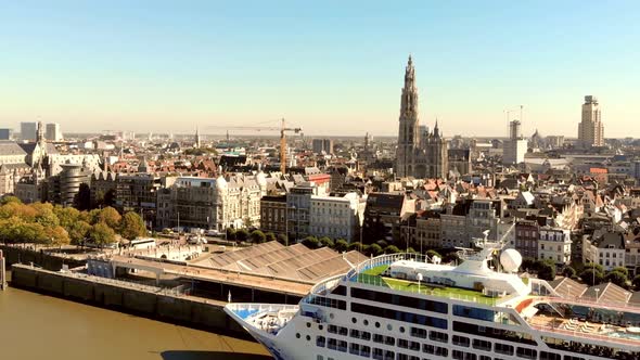 Cathedral of Our Lady Antwerp and Antwerp cityscape. Cruise ship docked at terminal.