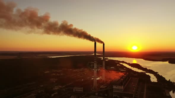 Aerial view of industrial area. Aerial view of powerplant with smoke coming out of the chimneys