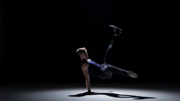 Young Blonde Dancer Man Dancing Breakdance on Black