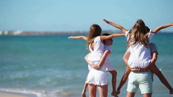 Photo of Happy Family Having Fun on the Beach. Summer Lifestyle