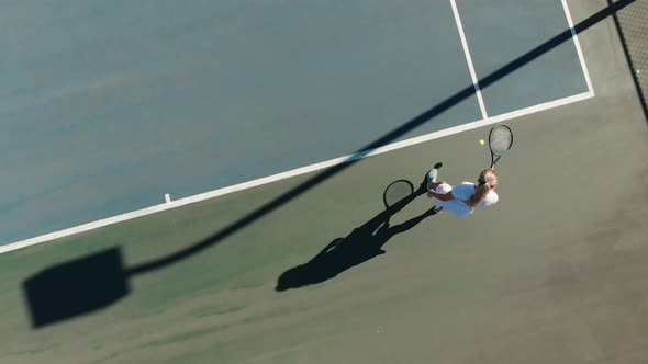 Video of top view of caucasian female tennis player on court