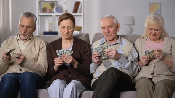 Poor Aged Couples Counting Dollars at Home, Lack of Money, Social Insecurity