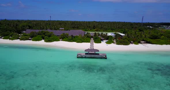 Luxury above island view of a white sand paradise beach and aqua blue water background 