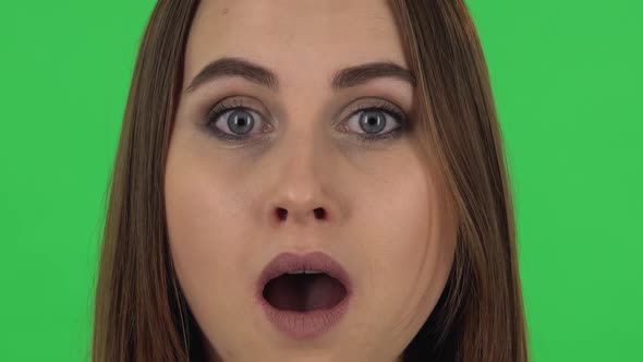 Woman with the Wow Emotion of Surprise on a Green Screen. Close Up.