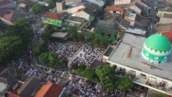 Aerial View of People offering prayers on the Eid morning at famous mosque Jama Masjid in Bekasi.