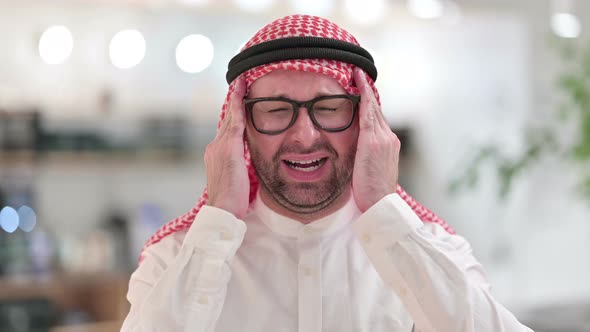 Exhausted Young Arab Businessman Having Headache