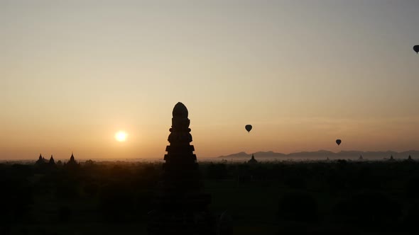 Balloons flying during sunrise over the Pagodas in Bagan