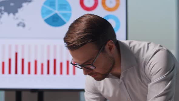 Young businessman at work after a presentation