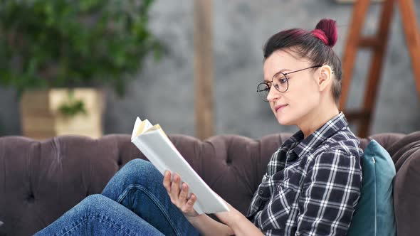 Confident Teenager Woman Reading Book Turning Paper Page Enjoying Weekend at Home