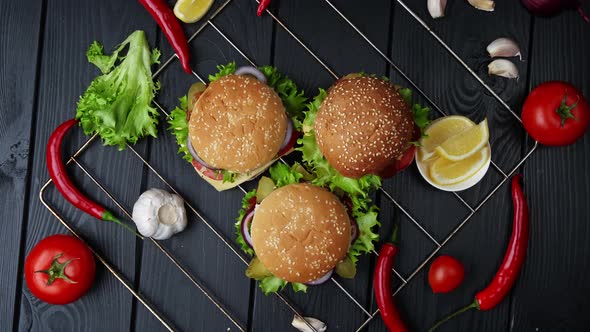 Vegetarian Burgers on a Black Background with Different Vegetables