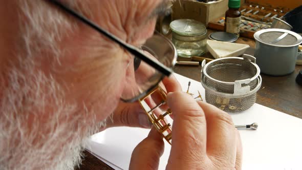 Horologist repairing a watch