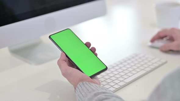 Close Up of Using Smartphone with Green Mock-up Screen