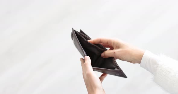 Woman Looks Into Empty Wallet and Throws It on Floor Slow Motion  Movie