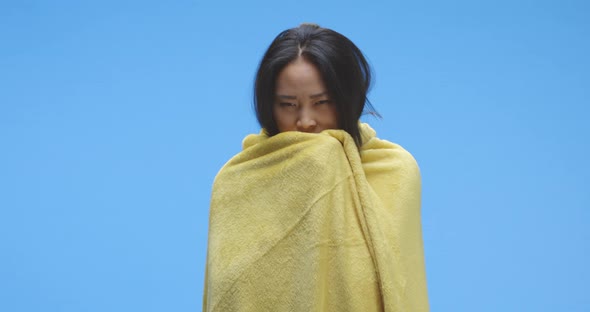 Ill Woman Wrapped in Blanket