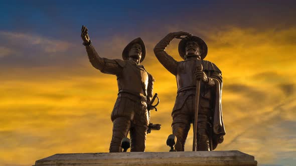 Slow zoom in, time lapse of Francisco de Montejo monument in Merida, Mexico with a sunset yellow sky