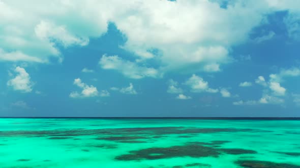 Aerial flying over sky of relaxing island beach time by blue green sea with white sand background of