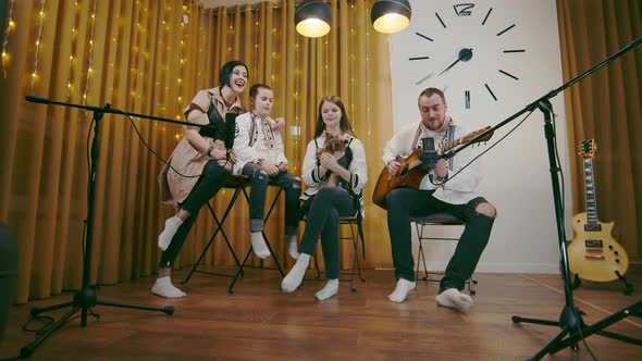 Big Happy Family Sings and Father Plays the Guitar