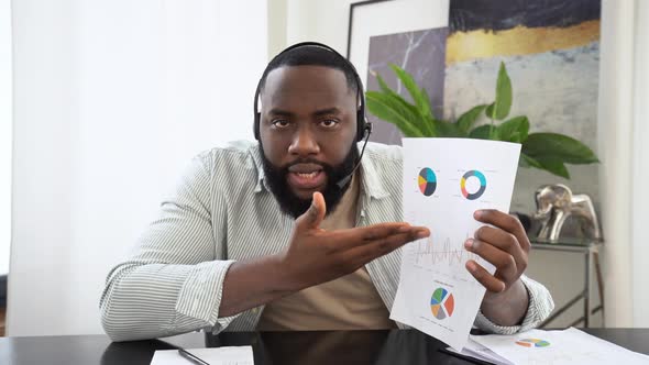 Stunned Angry Annoyed African American Man with Headset Business Leader or Coach Talking with