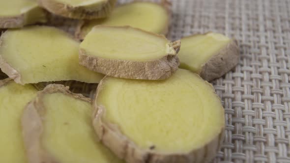 Slices of dried natural organic ginger root on a patterned napkin