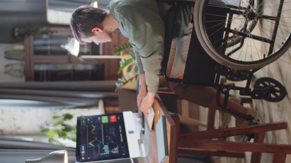 Woman on Wheelchair Working on Computer from Home
