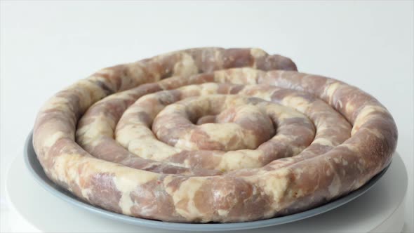 Raw Homemade Sausage Lies on the Cutting Board