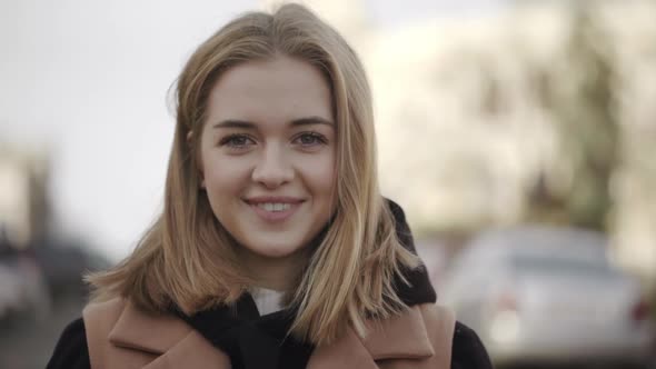 Portrait of Joyous Female Looking on Camera and Smiling with Perfect Teeth Feeling Good on Fresh