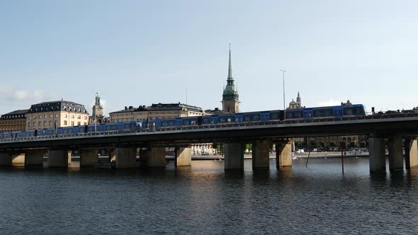 Metro passing by with Gamla stan islands in the background