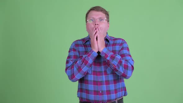 Stressed Overweight Bearded Hipster Man Looking Shocked