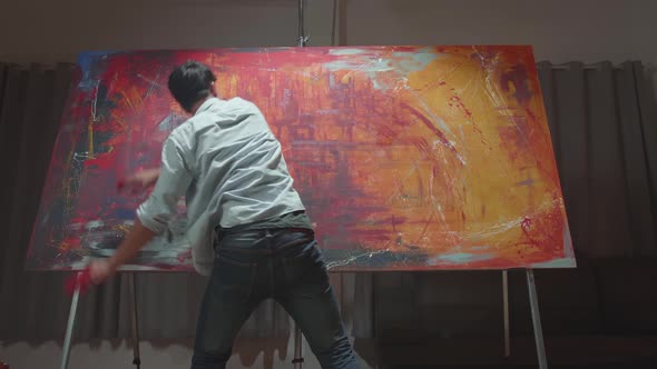 Talented Innovative Male Artist Draws With His Hands On The Large Canvas