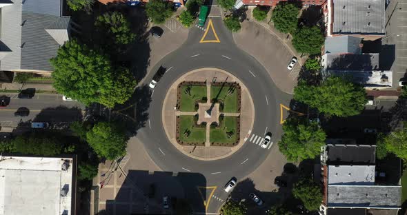 Public square with roundabout in downtown Franklin, Tennessee with cars driving. Drone video.