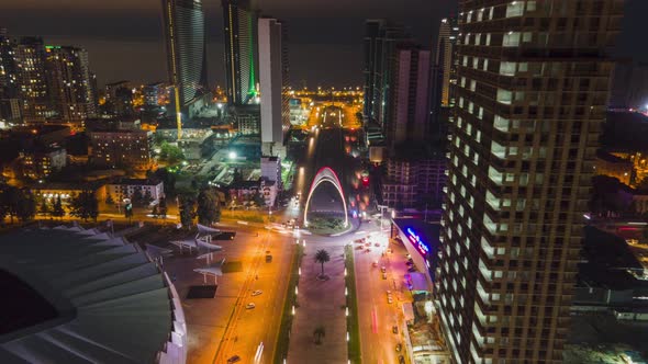 Aerial hyperlapse of Dinamo Batumi Stadium near Heroes Square against cityscape