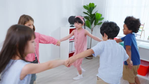 Mixed race Group of young children student playing together in school.